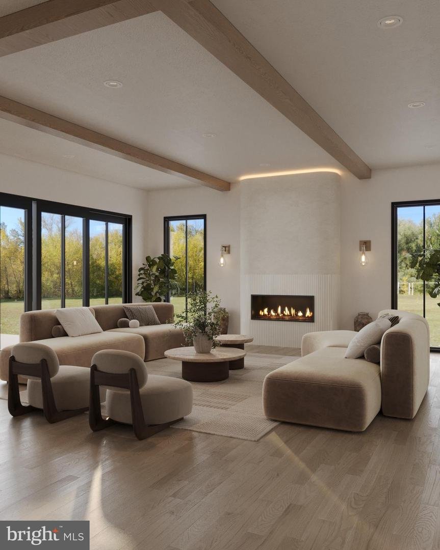 Rendering of the great room with exposed beams, a linear gas fireplace, and floor-to-ceiling black-framed windows on three sides